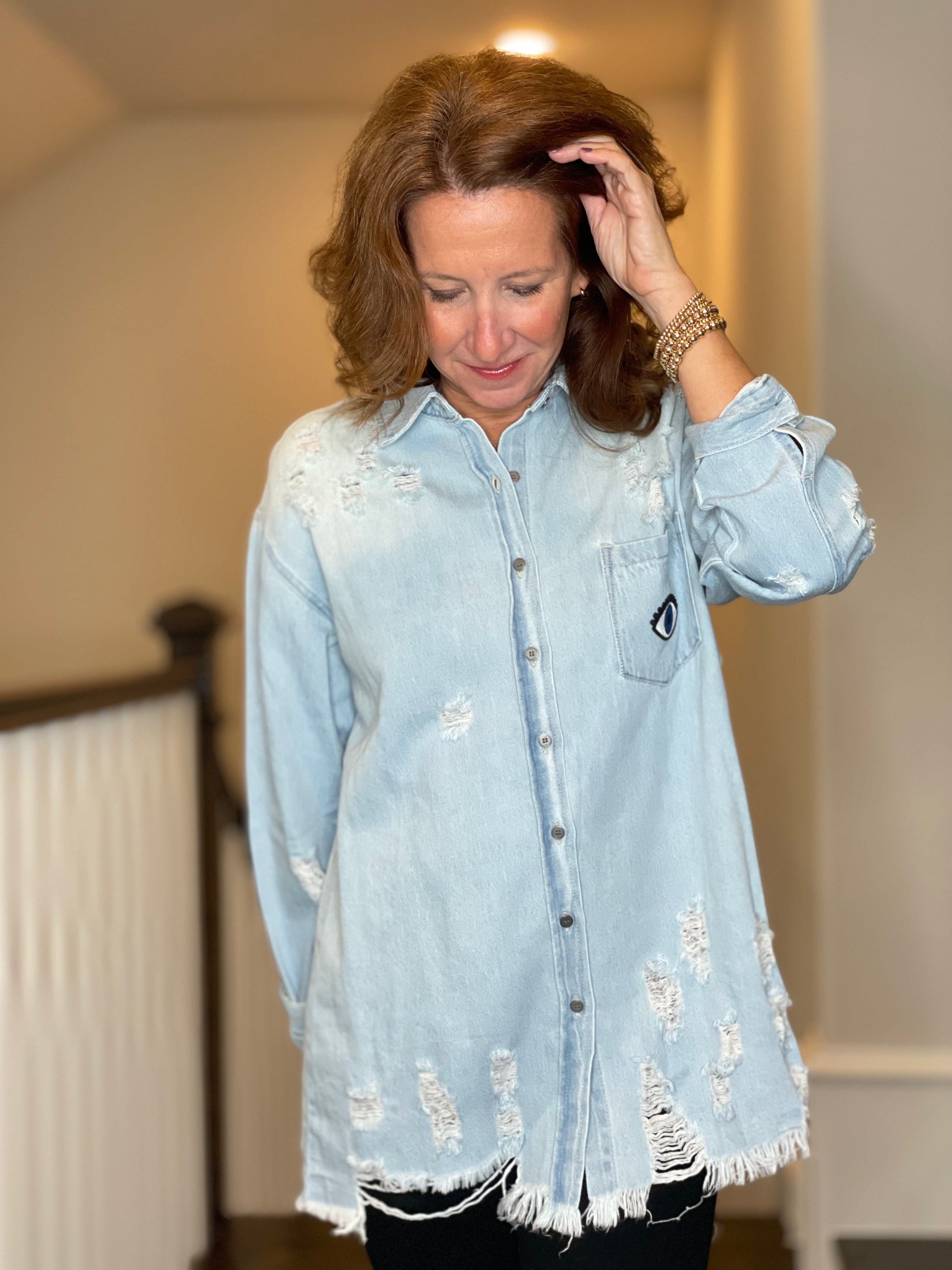 Distressed Denim Shacket with Evil Eye Heart Embellishment.