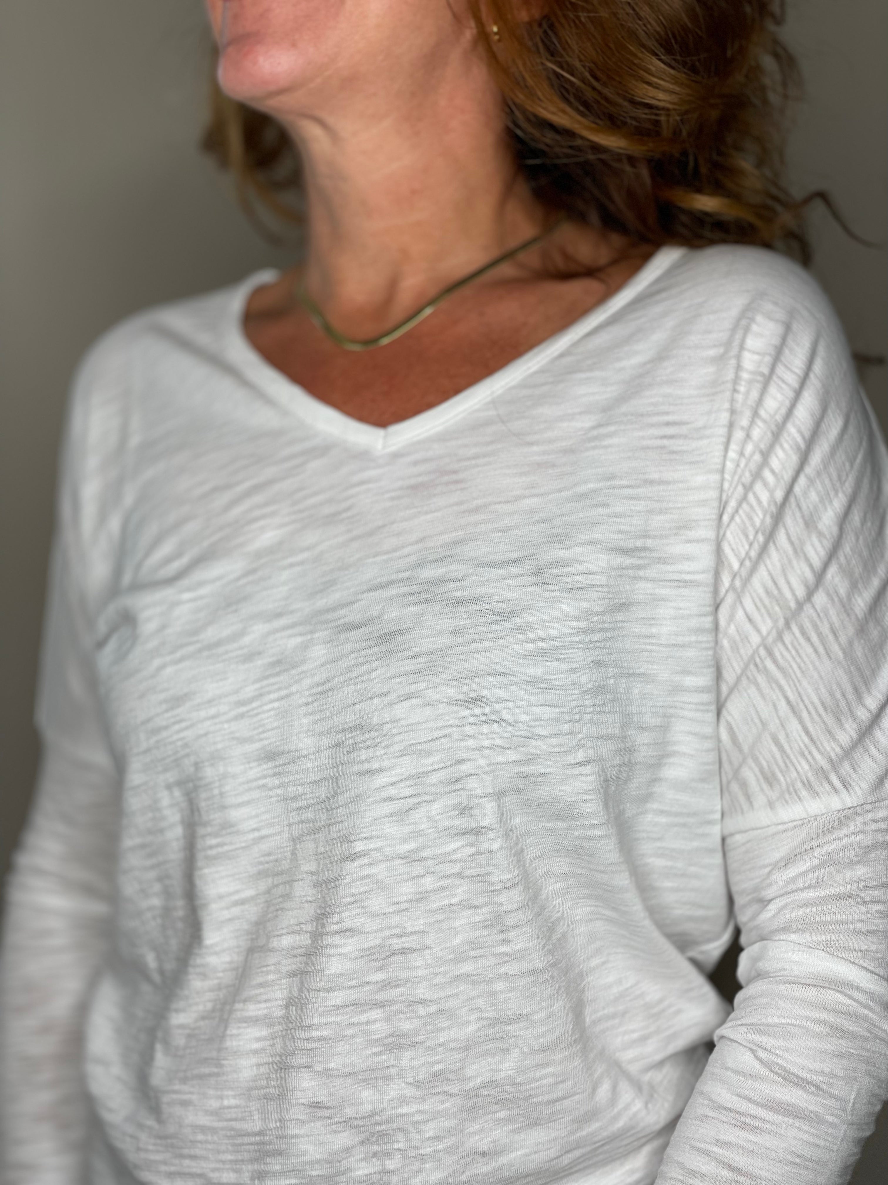 Erin Gray 3/4 Sleeve Dolman V Neck in White.