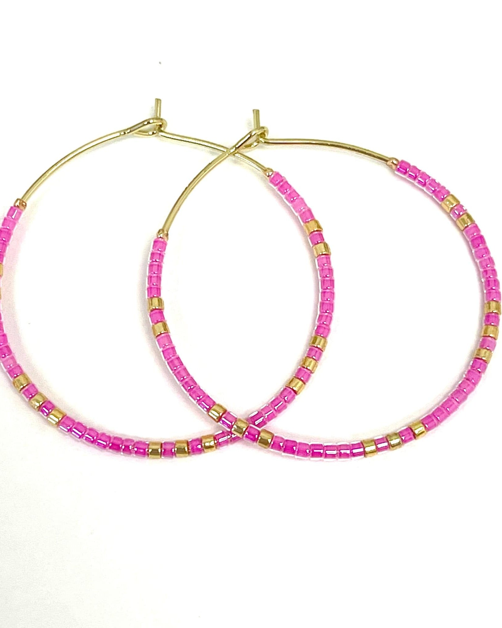 Caryn Lawn Baja Hoop Earrings in Pink.