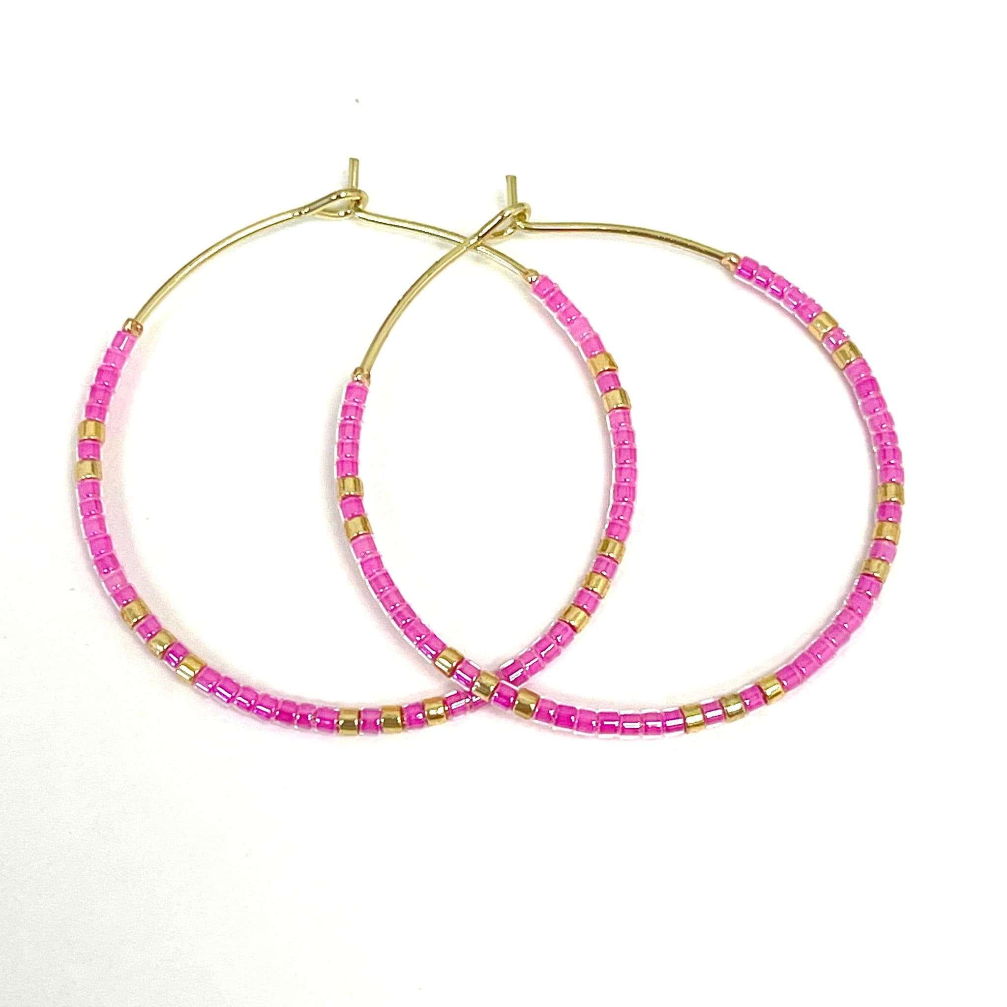 Caryn Lawn Baja Hoop Earrings in Pink.