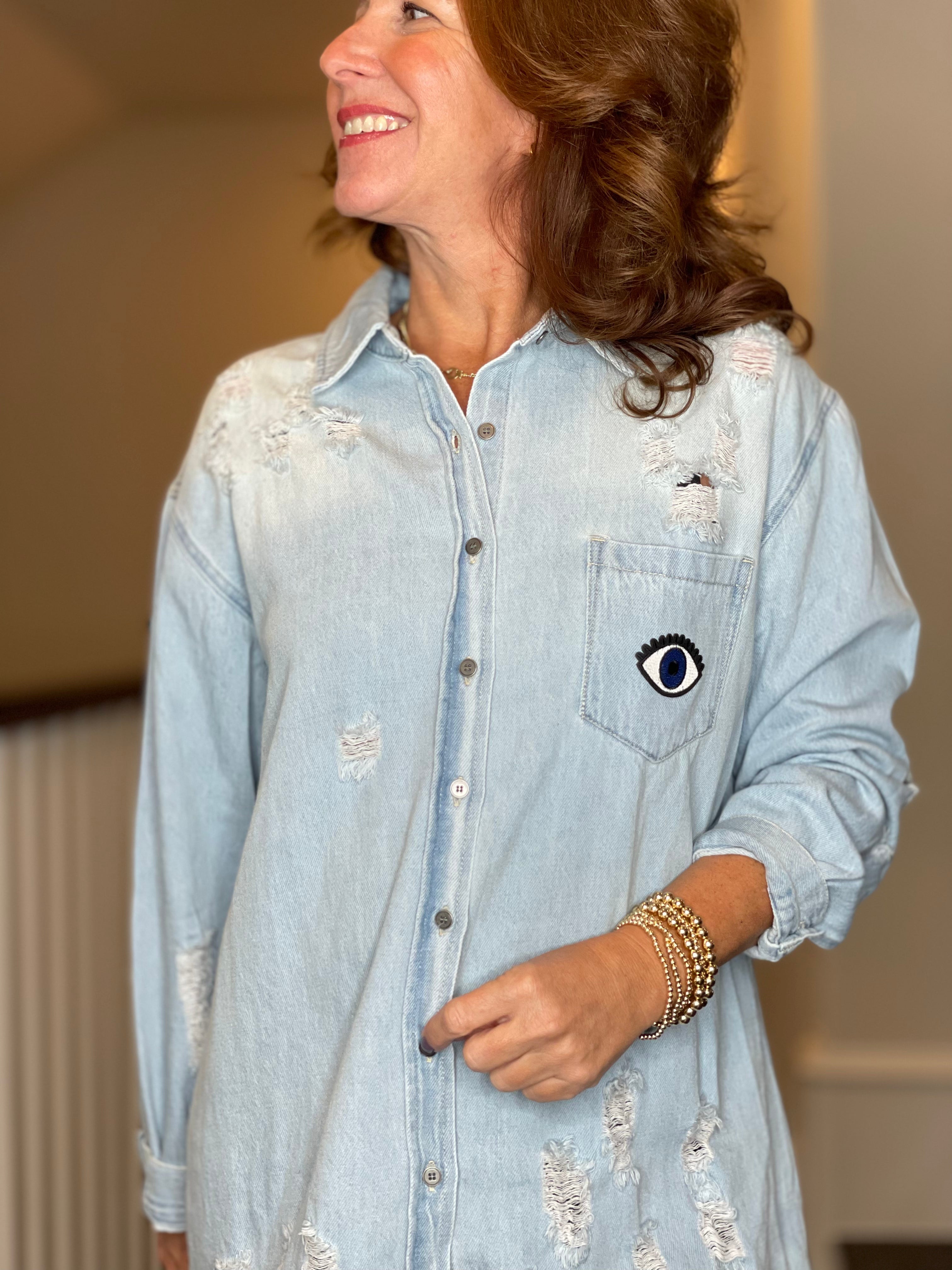 Distressed Denim Shacket with Evil Eye Heart Embellishment.
