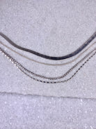 Silver Quad-Strand Mixed Chain Herringbone Necklace.