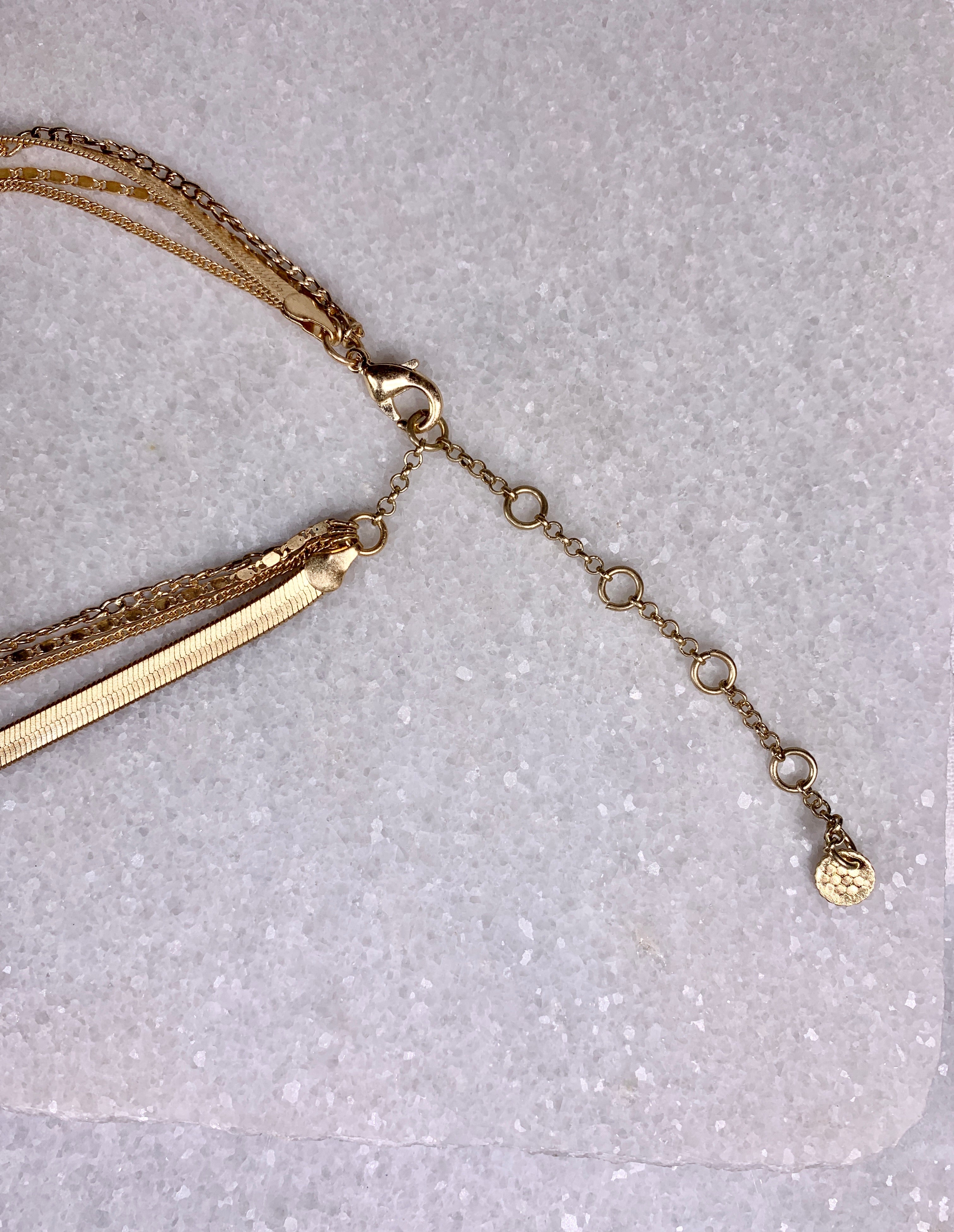 Gold Quad-Strand Mixed Chain Herringbone Necklace.
