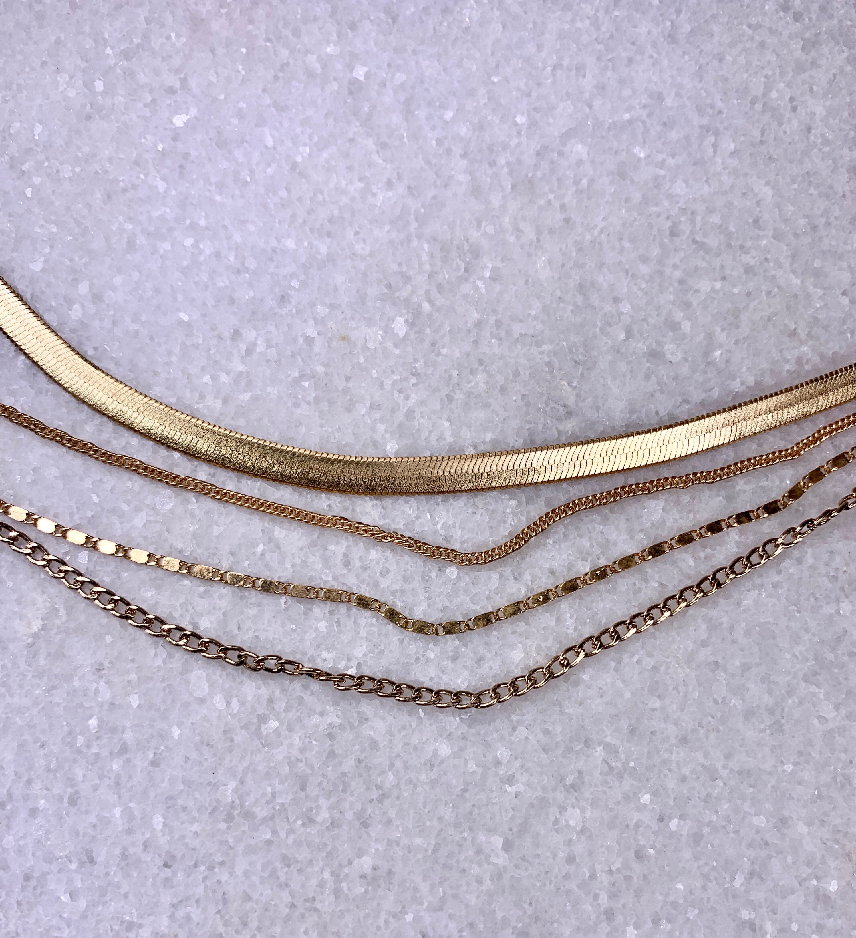Gold Quad-Strand Mixed Chain Herringbone Necklace.