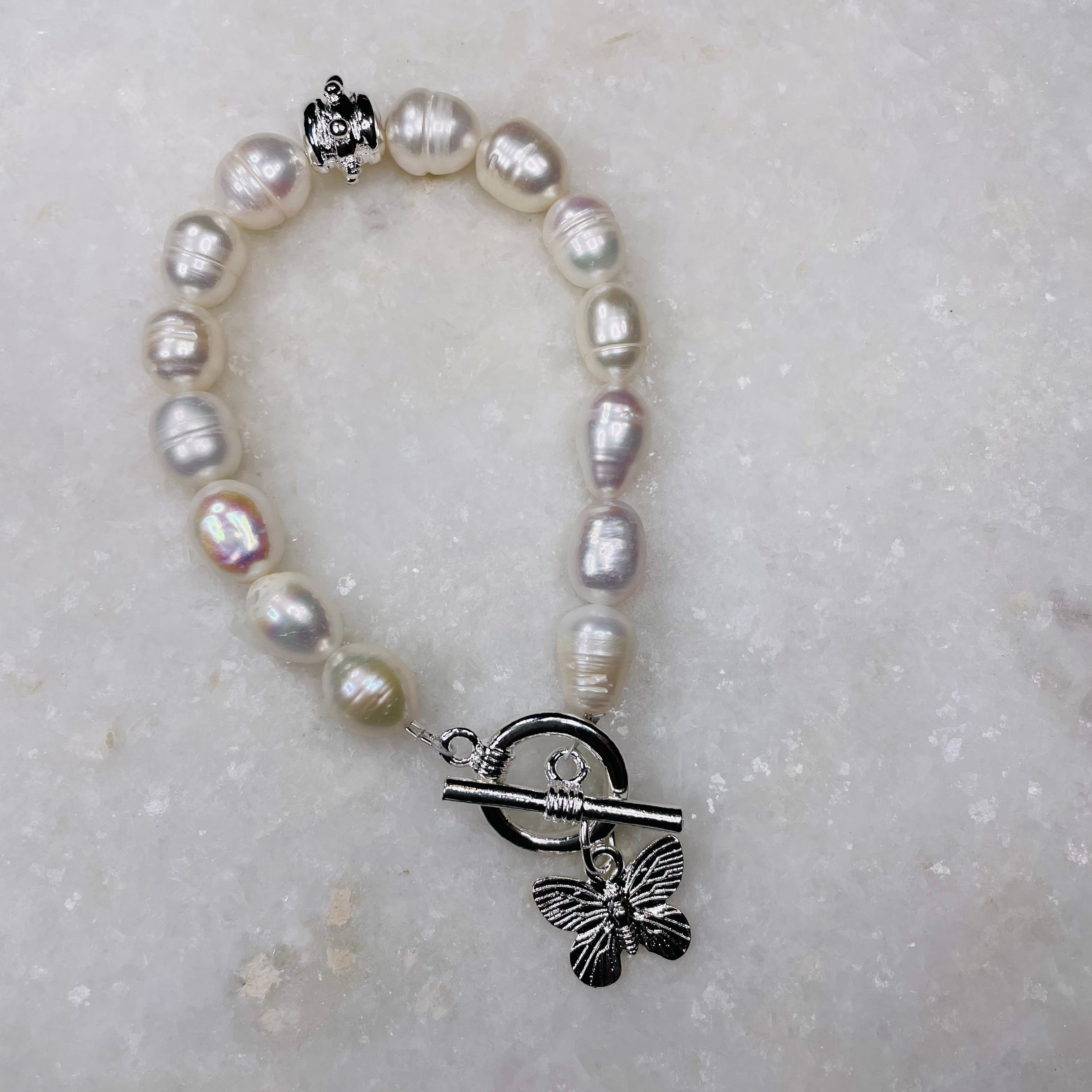 Susan Shaw Pearl Bracelet w/Butterfly Charm in Silver.