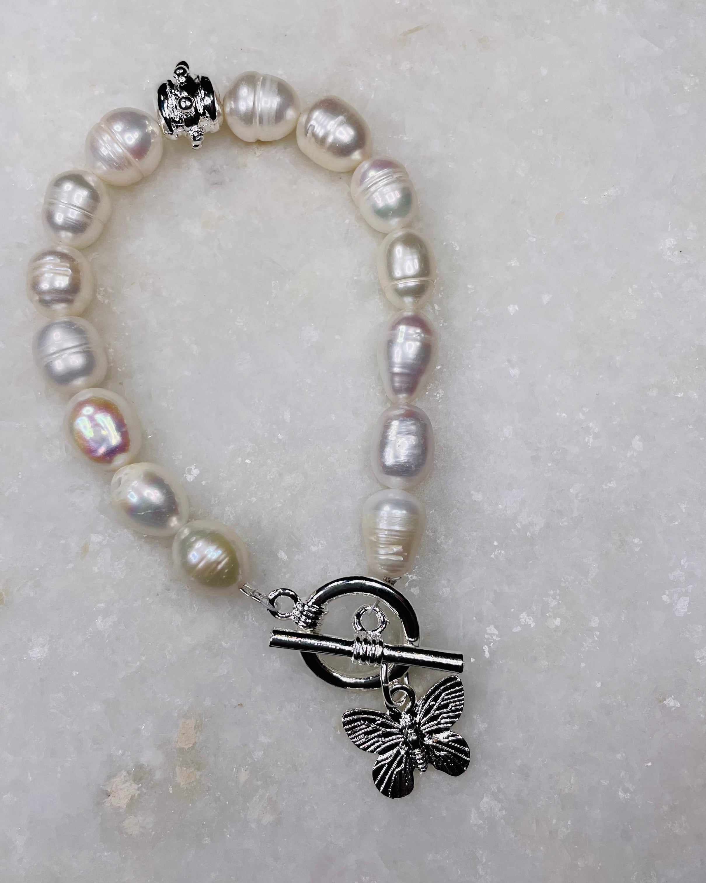 Susan Shaw Pearl Bracelet w/Butterfly Charm in Silver.