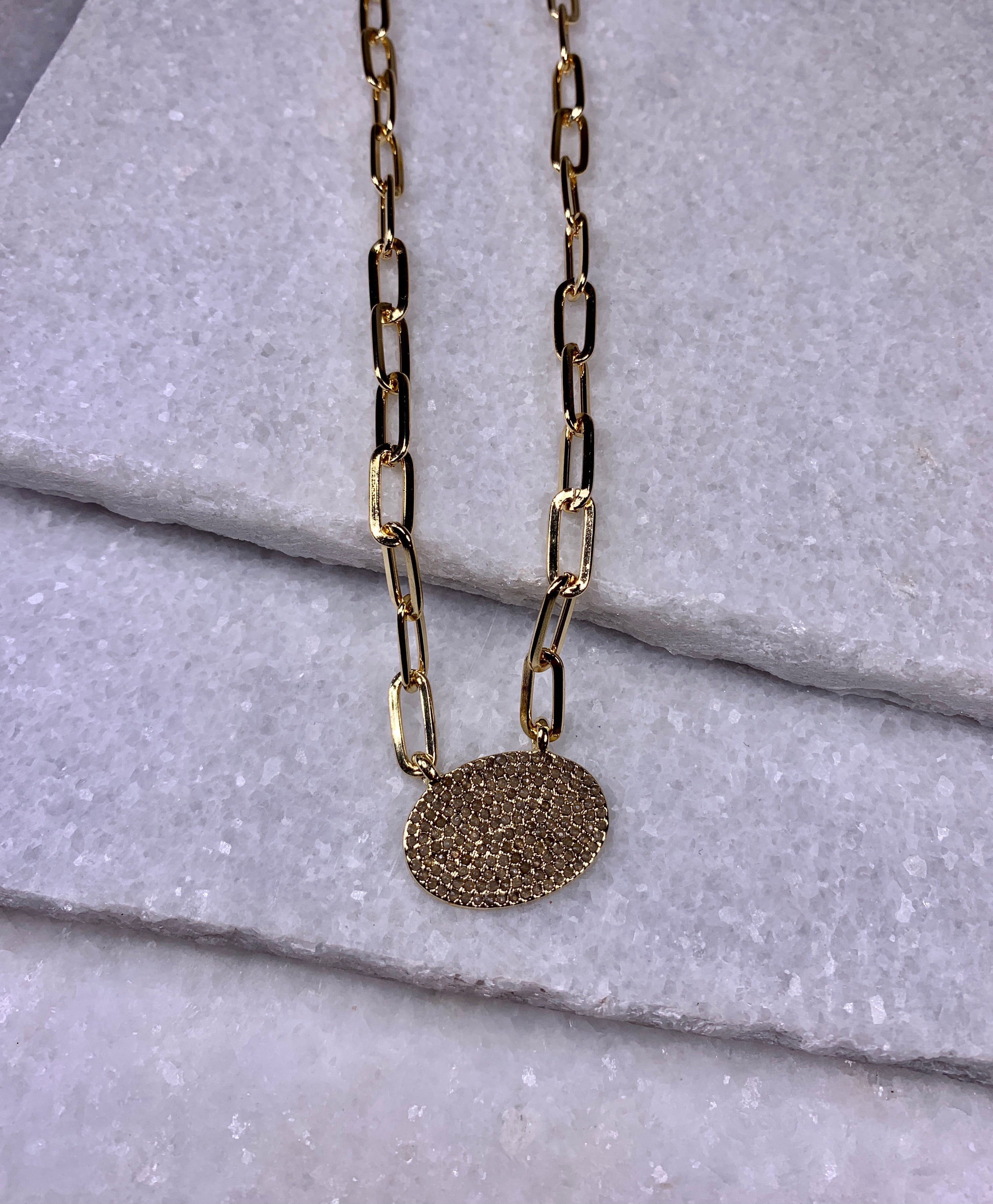 Gold Chain Link with Oval Charm.