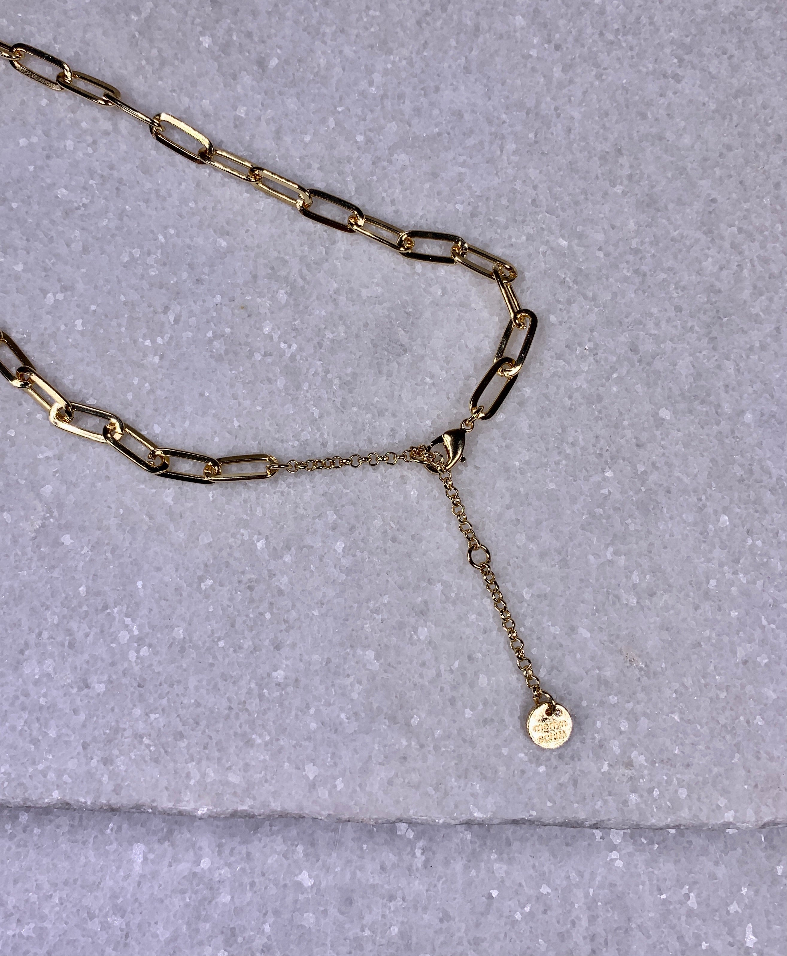 Gold Chain Link with Oval Charm.