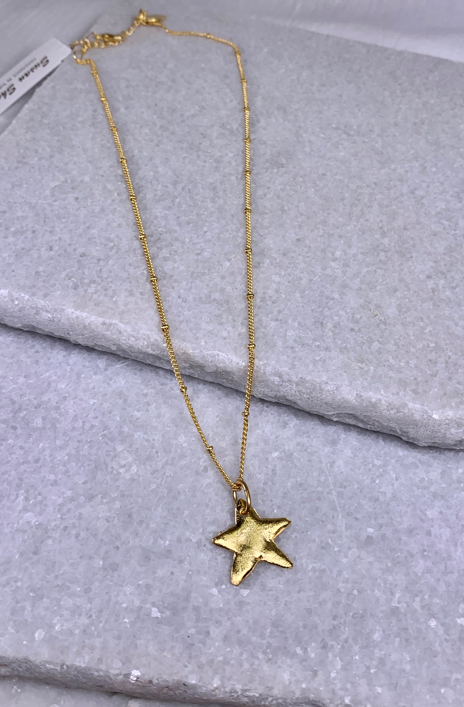 Susan Shaw Dainty Gold Star Necklace.