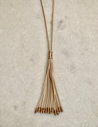 Long Suede Tassel Necklace w/Metal Tips.