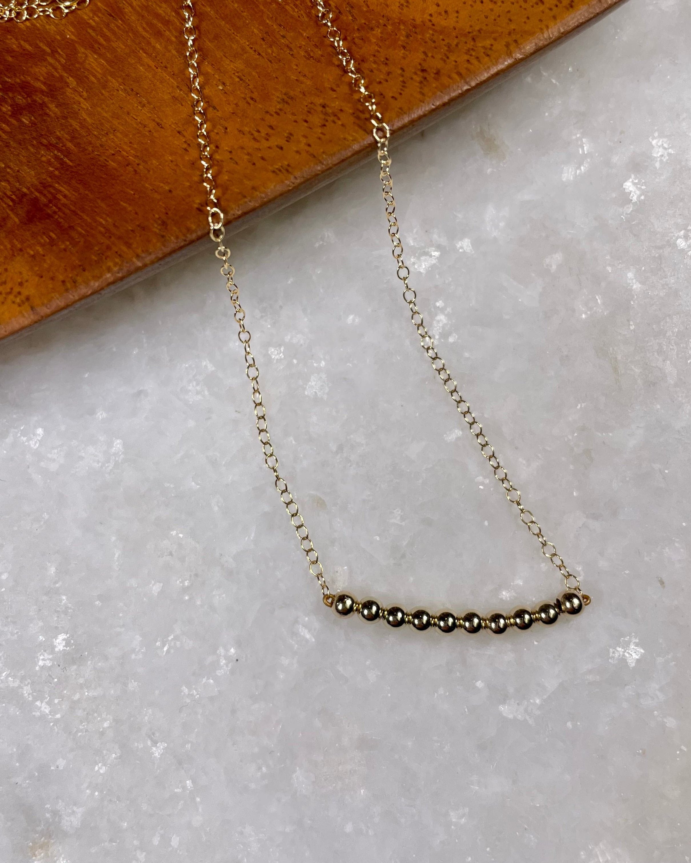 Gold Bead Bar Necklace.