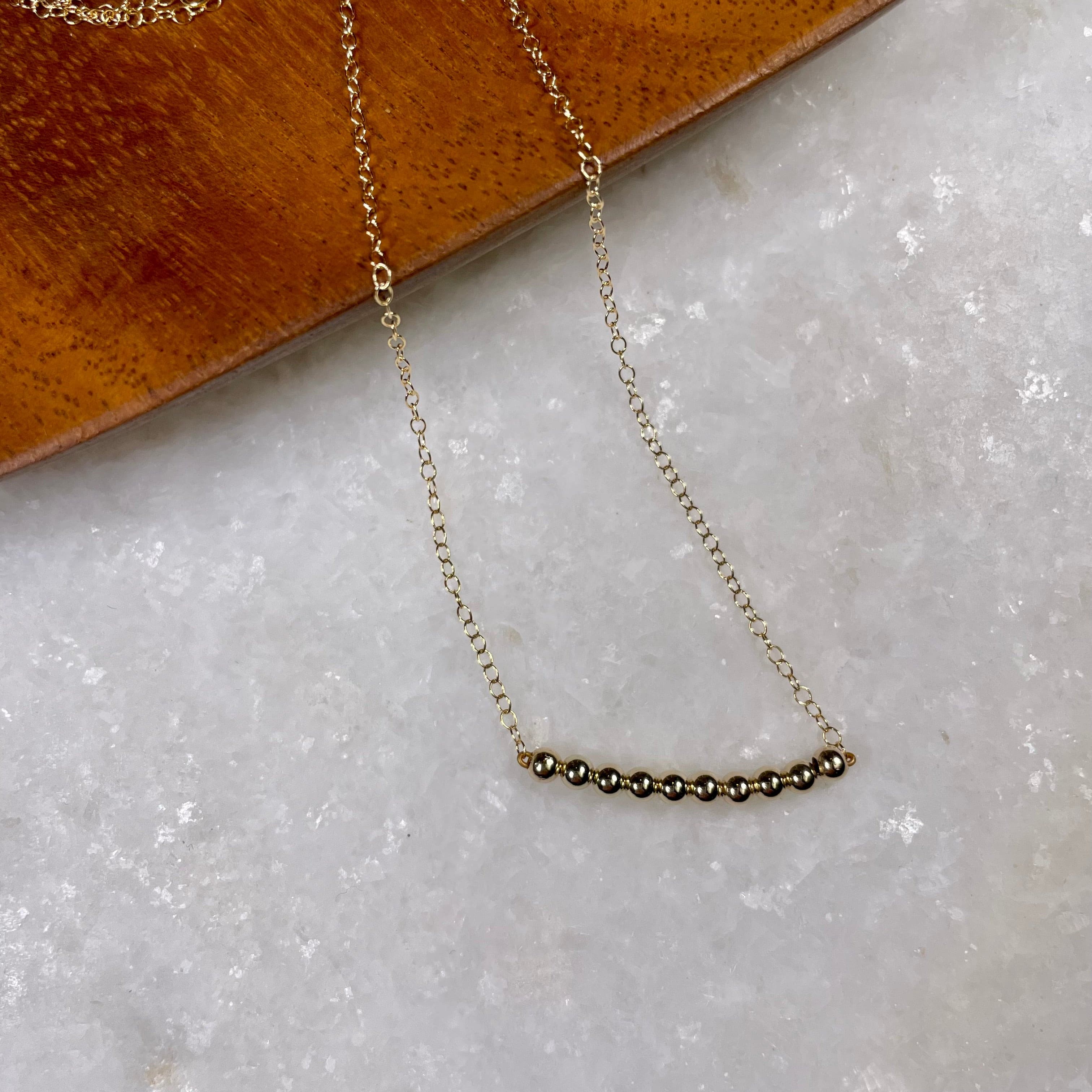 Gold Bead Bar Necklace.