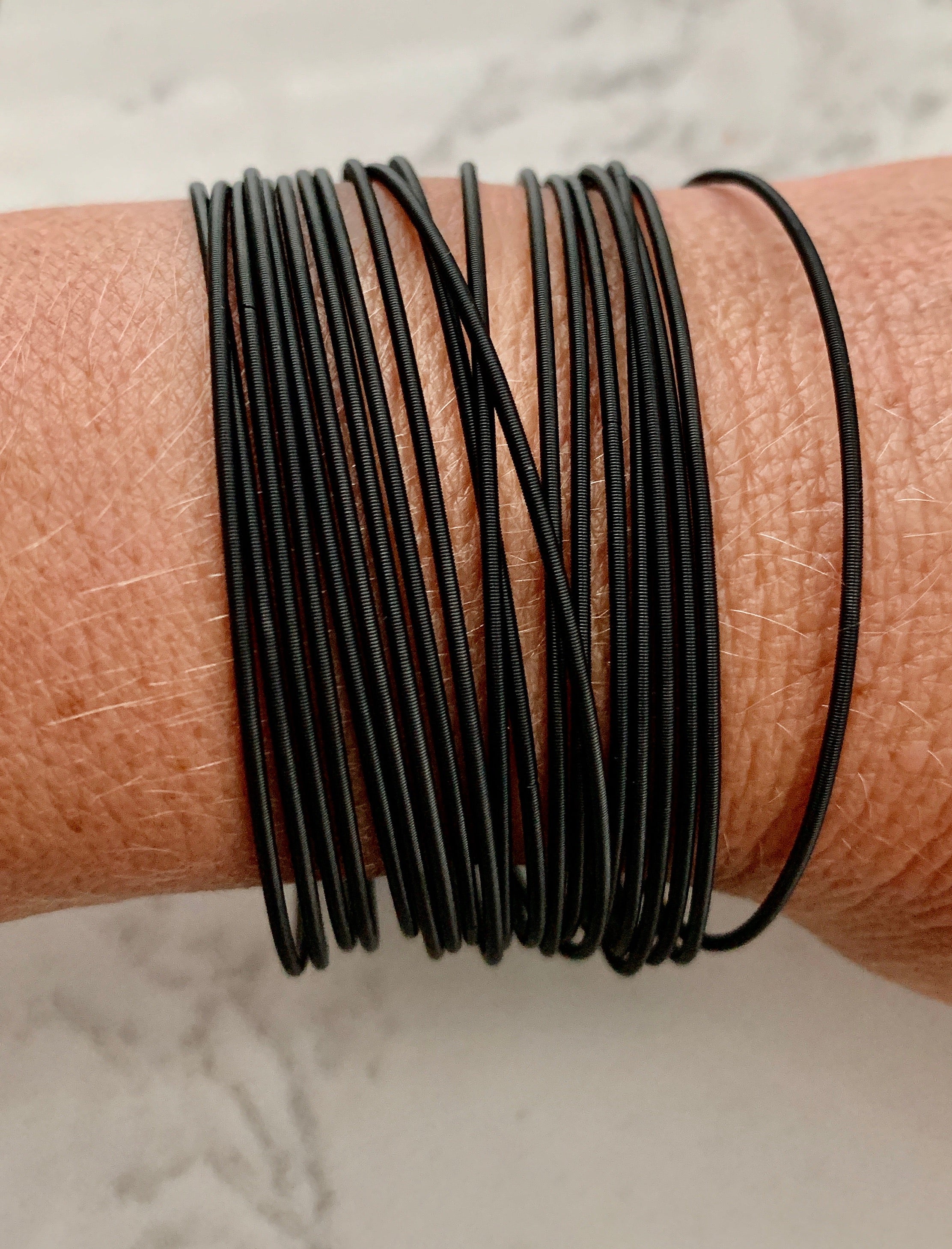 Stainless Steel Black Guitar String Bracelets - Set of 20.
