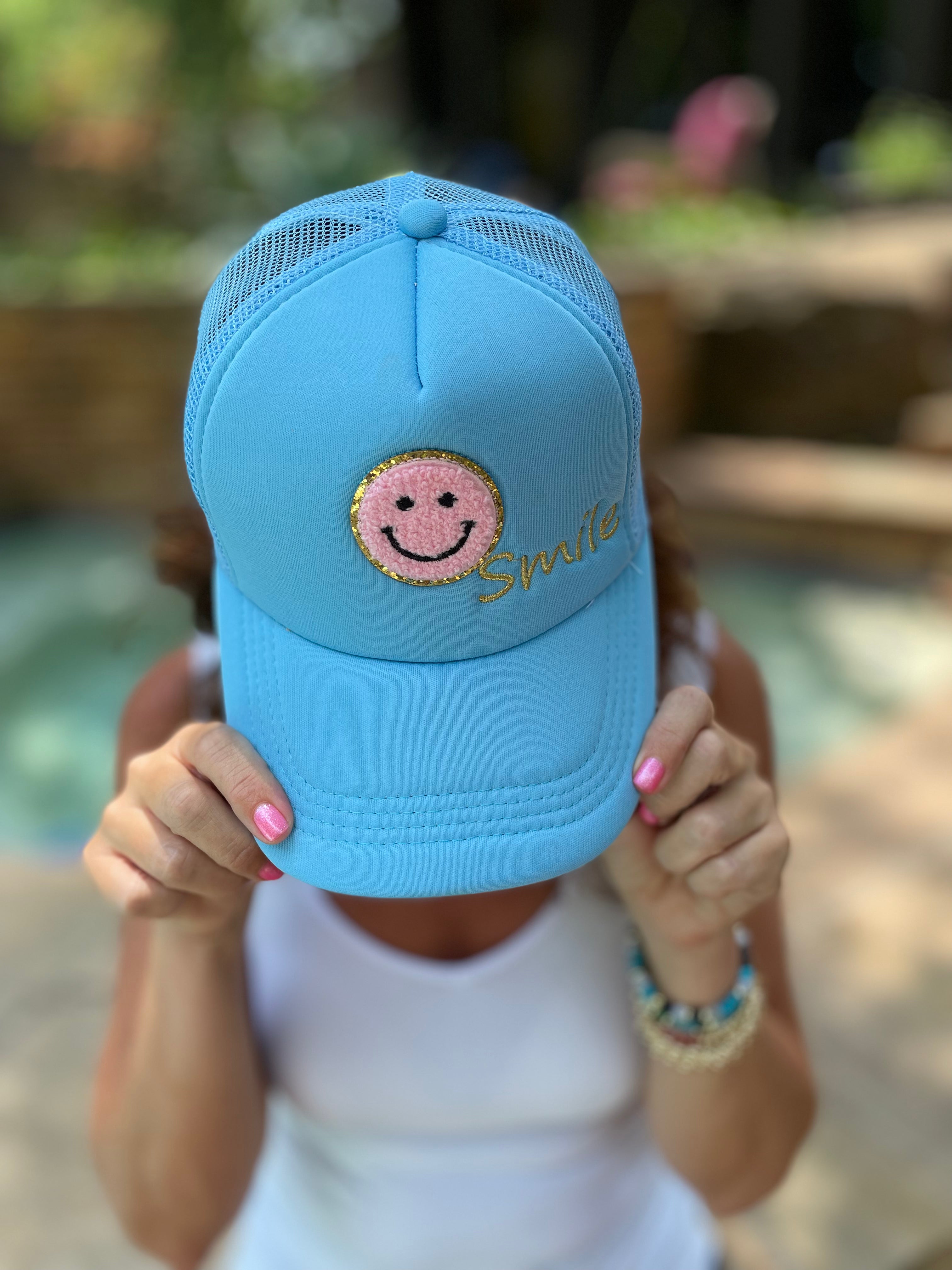 Caryn Lawn Smile Trucker Hat.